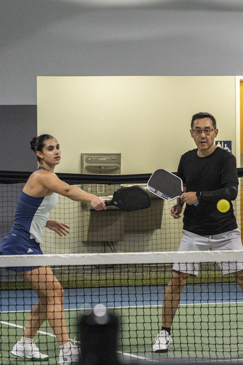 Doubles pair at the net during a point