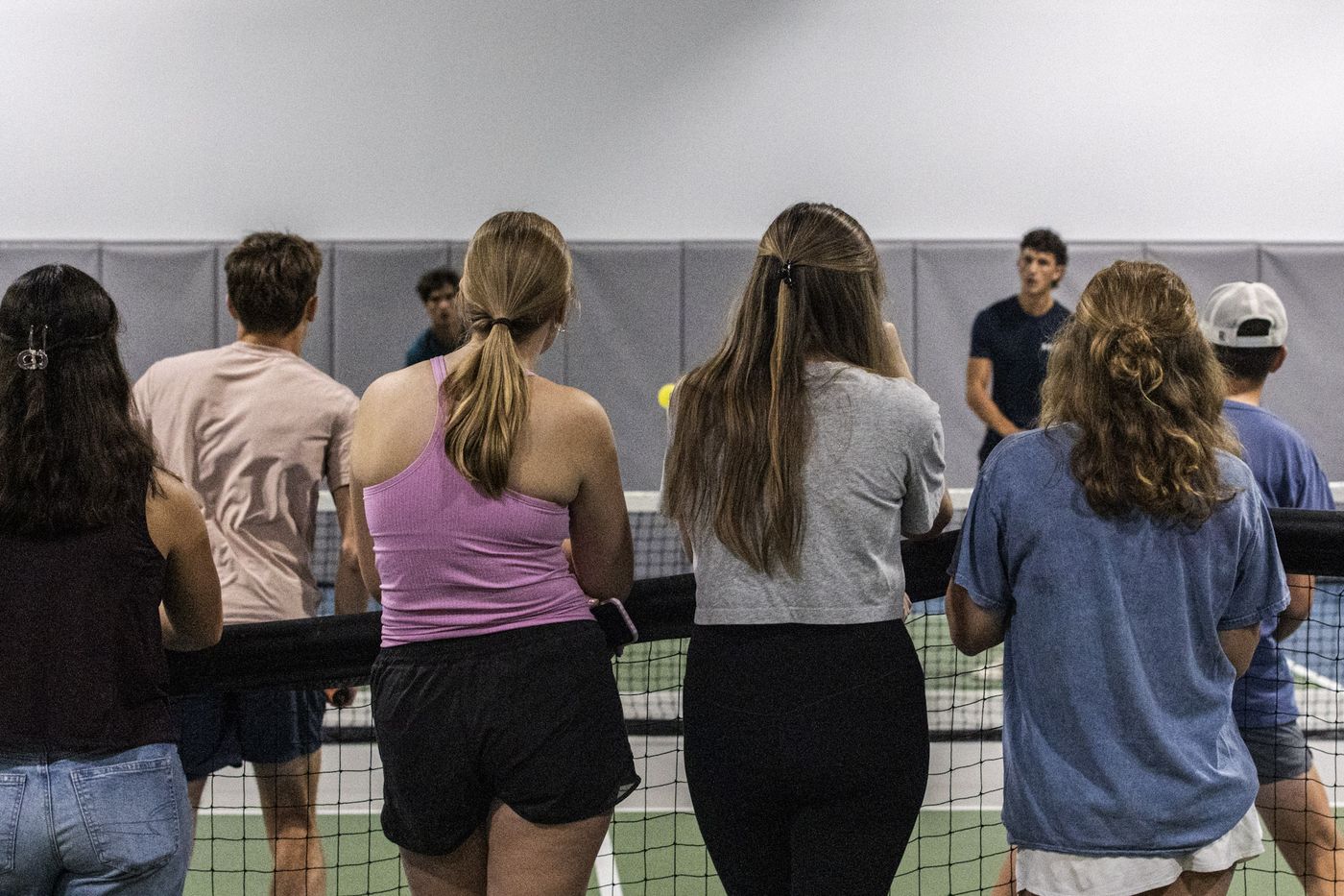 Players lined up along the net between games