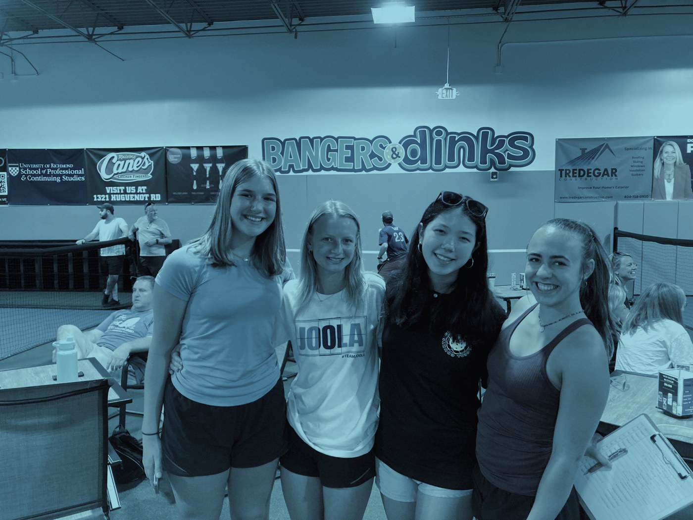 Four players posing together at Bangers & Dinks