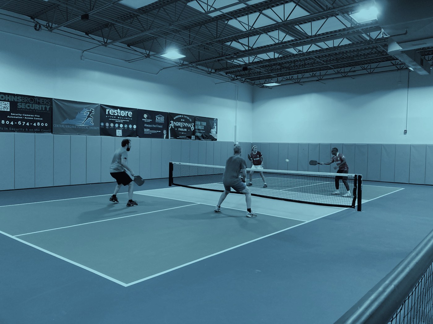 Doubles match on the indoor courts