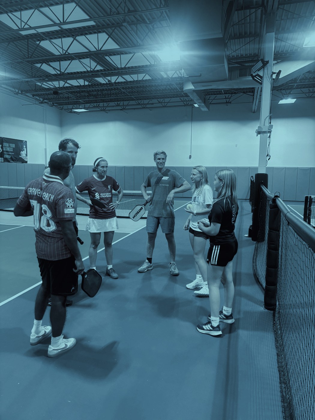 Players talking on court between games