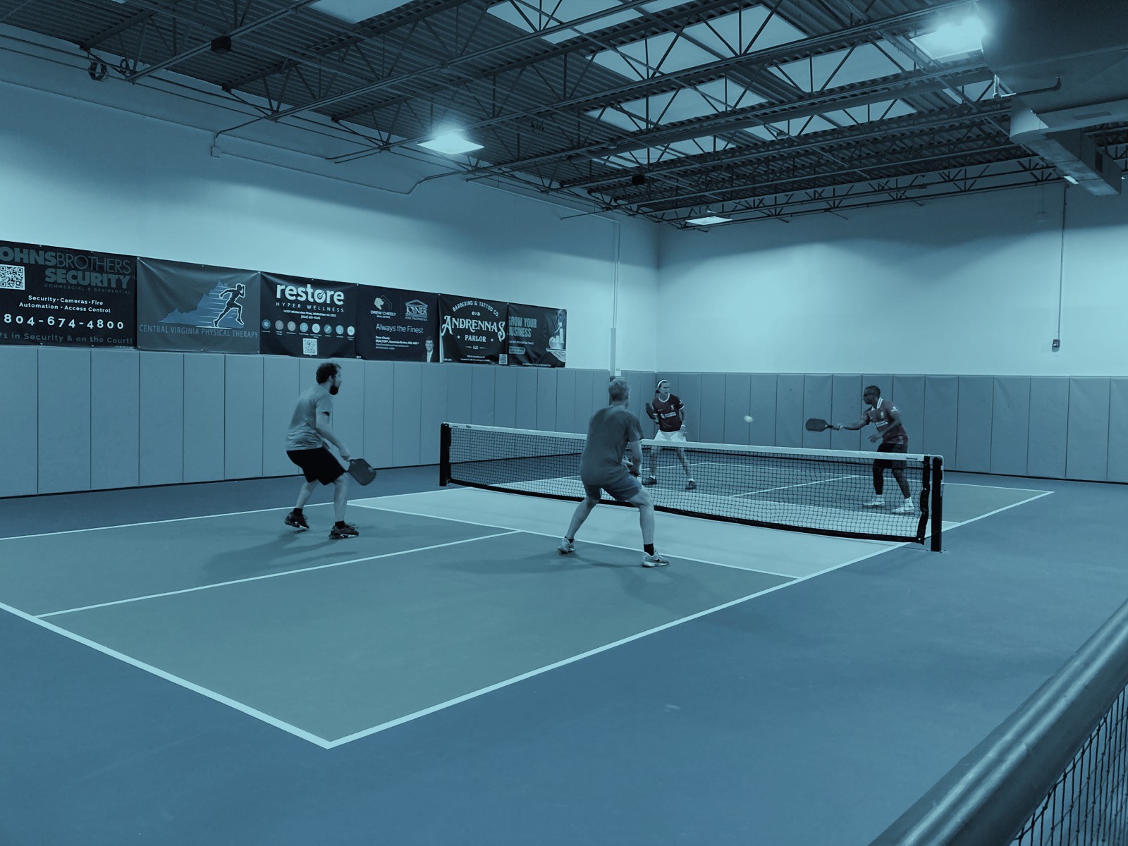 Players rallying during a Paddles with Purpose pickleball game