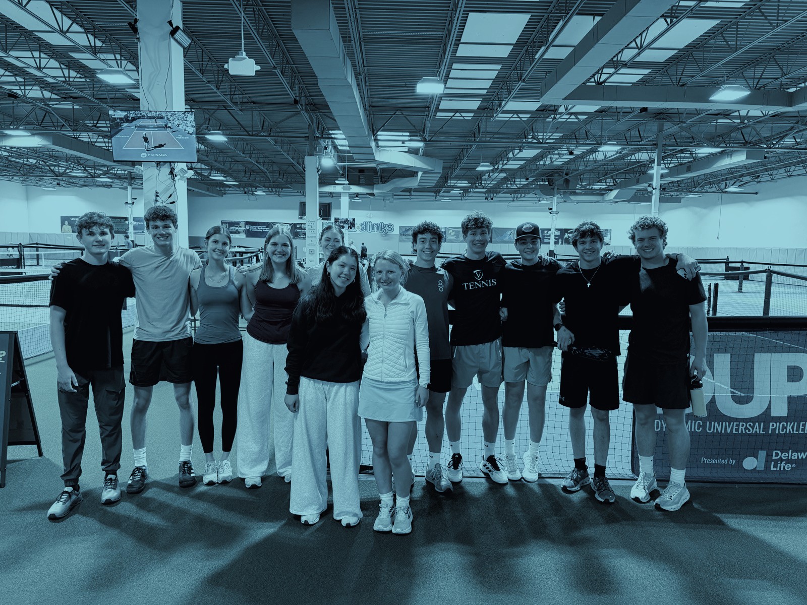 Group of Paddles with Purpose players and volunteers at a pickleball event